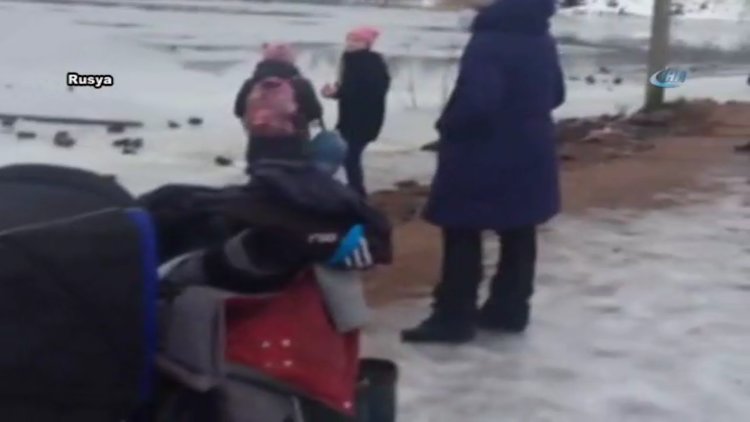 Donmuş göle düşen köpeği kurtardı