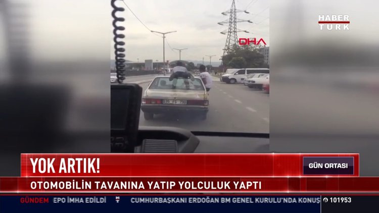 Otomobil tavanına yatıp yolculuk yaptı