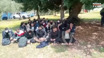 İzmir'de boş arazide 94 Afgan göçmen kurtarıldı