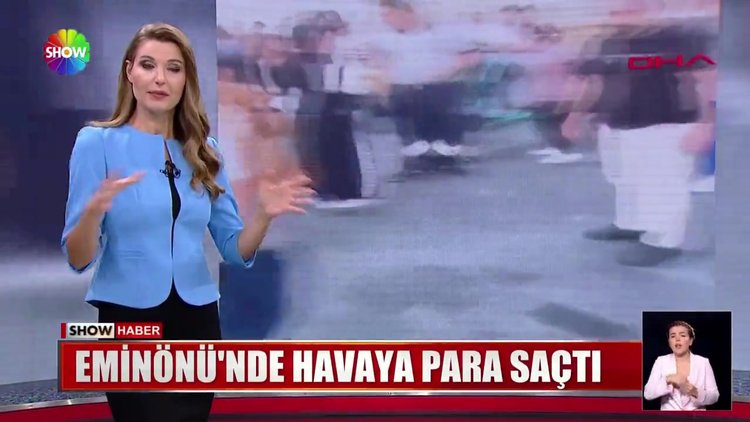 Eminönü'nde havaya para saçtı