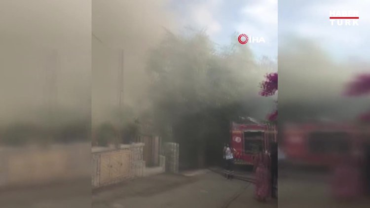 Yanan evini gözyaşlarıyla izledi