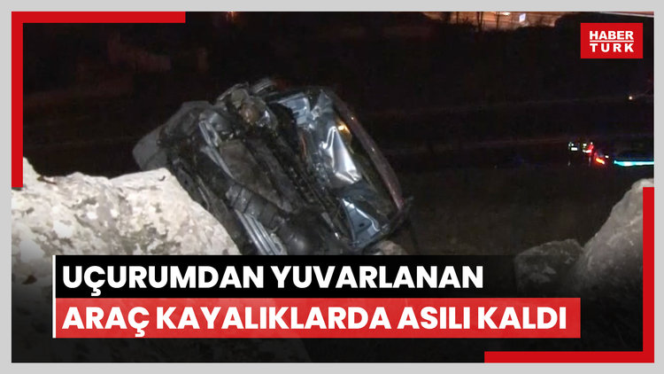 Uçurumdan yuvarlanan araç kayalıklarda asılı kaldı