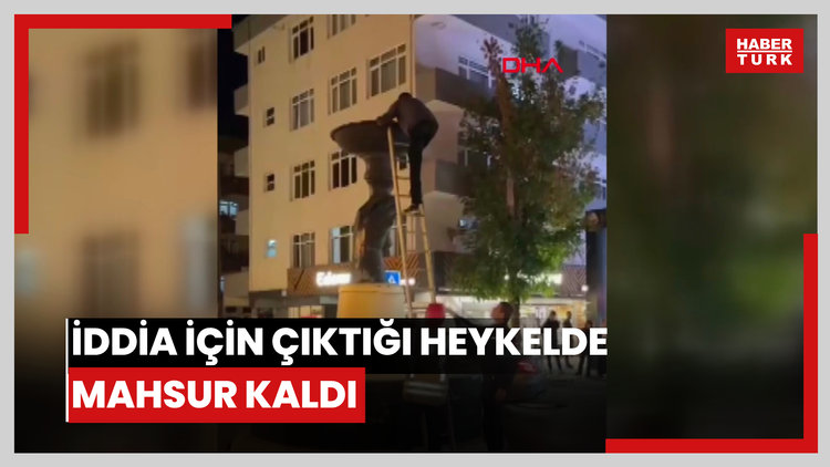 İddia için çıktığı heykelde mahsur kaldı