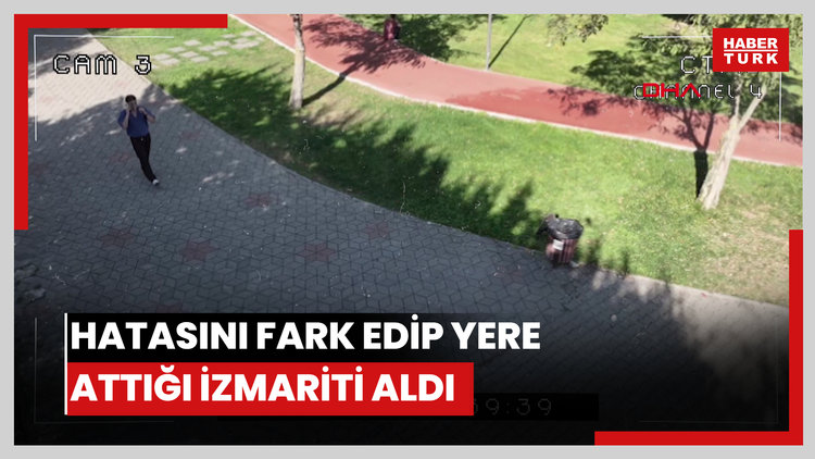 Hatasını fark edip yere attığı izmariti aldı, kameraya özür işareti yaptı