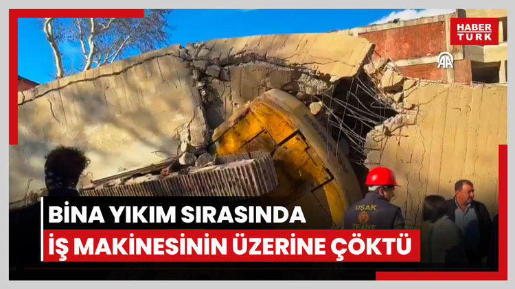 Bina yıkım sırasında iş makinesinin üzerine çöktü