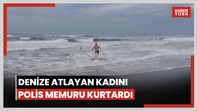 Denize atlayan kadını polis memuru kurtardı