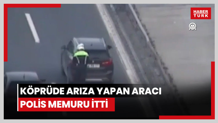 İstanbulda köprüde arıza yapan aracı polis memurunun itmesi güvenlik kamerasında