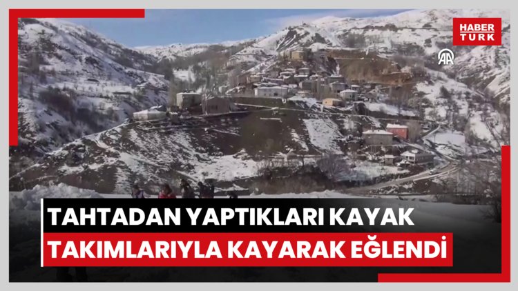 Köylüler tahtadan yaptıkları kayak takımlarıyla kayarak eğlendi