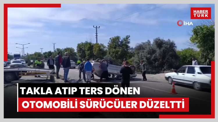 Takla atıp ters dönen otomobili sürücüler düzeltti
