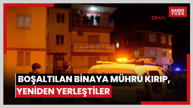 Derin çatlaklar nedeniyle boşaltılan binaya mührü kırıp, yeniden yerleştiler