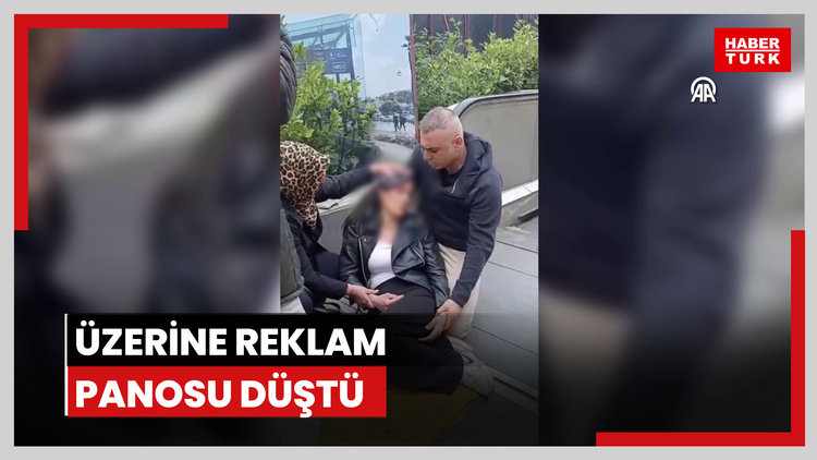 Üzerine reklam panosu düştü