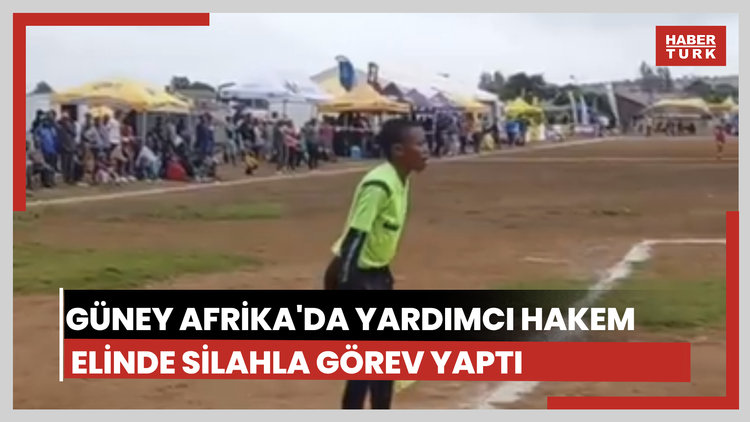 Yardımcı hakem elinde silahla maçta görev yaptı