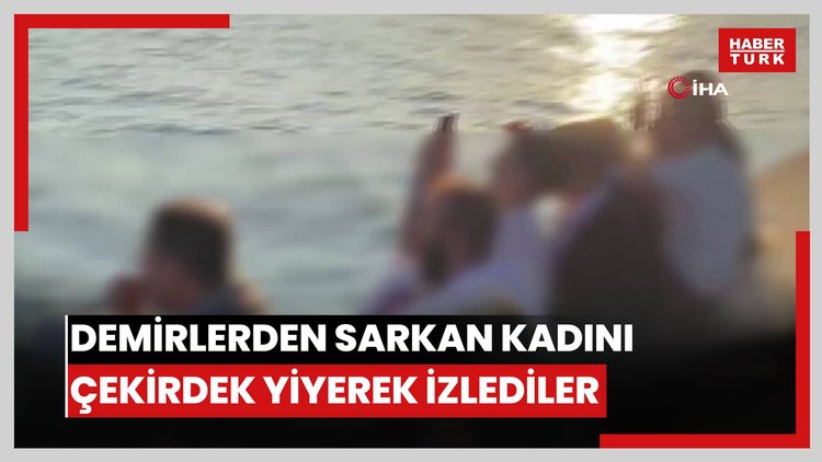 Haliç Metro köprüsünün altındaki demirlerden sarkan kadını çekirdek yiyerek izlediler