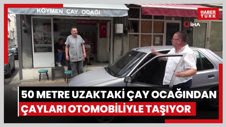 50 metre uzaklıktaki çay ocağından aldığı çayları otomobiliyle taşıyor