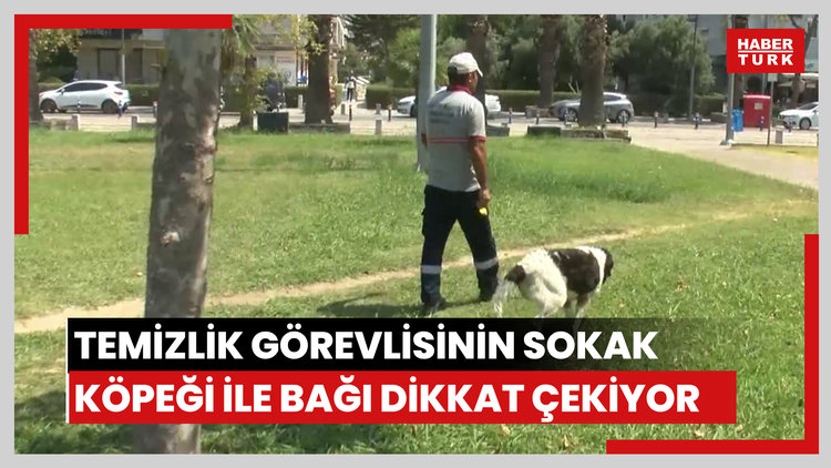 Temizlik görevlisinin sokak köpeği ile bağı dikkat çekiyor
