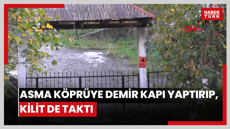 Asma köprüye demir kapı yaptırıp, kilit de taktı
