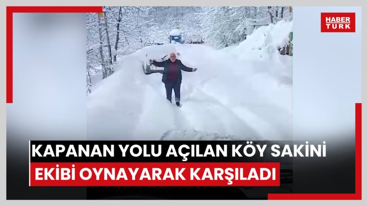 Kar nedeniyle kapanan yolu açılan köy sakini ekibi oynayarak karşıladı