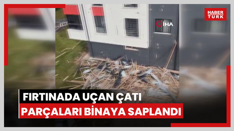 Fırtınada uçan çatı parçaları binaya saplandı