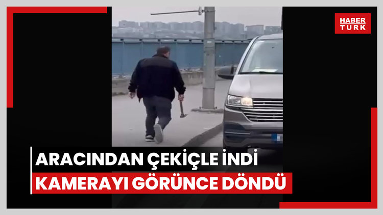 Aracından çekiçle indi, kamerayı görünce geri döndü
