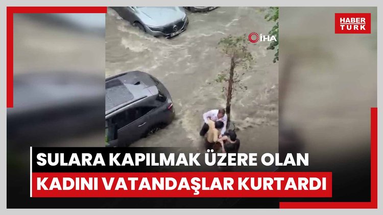 Beşiktaş'ta sağanakta can pazarı kamerada: Sulara kapılmak üzere olan kadını vatandaşlar kurtardı
