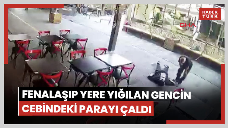 Fenalaşıp yere yığılan gencin cebindeki parayı çaldı; o anlar kamerada