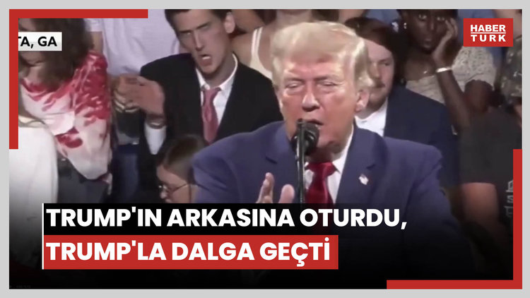 Trump'ın arkasına oturdu, Trump'la dalga geçti