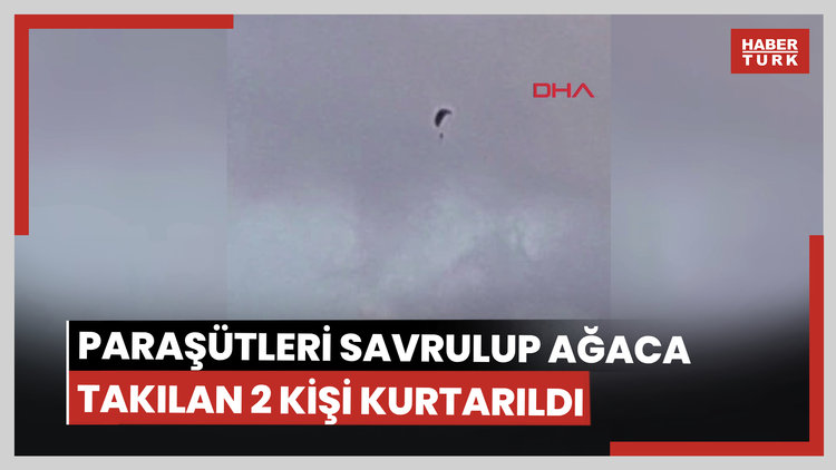 Paraşütleri rüzgarda savrulup zeytin ağacına takılan 2 kişi kurtarıldı; o anlar kamerada