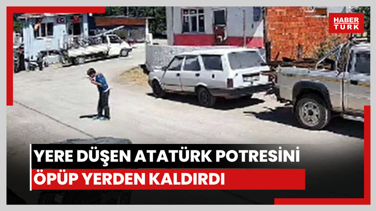 Yere düşen Atatürk portresini öpüp kaldırdı
