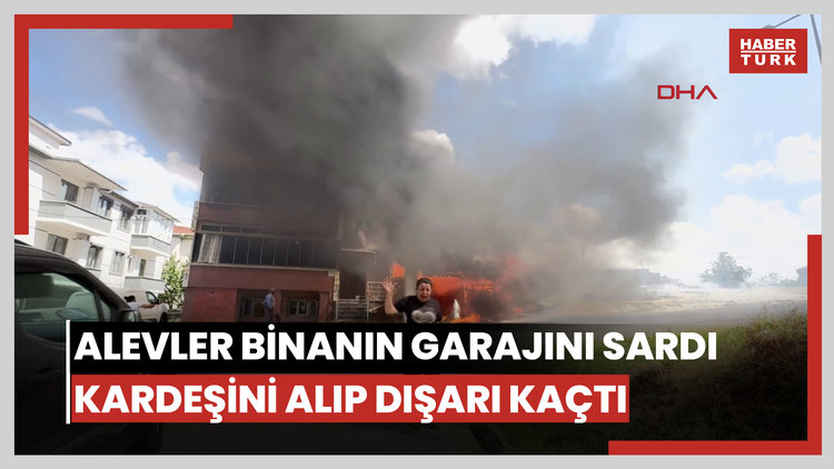 Alevler binanın garajını sardı, kardeşini kucağına alıp dışarı kaçtı
