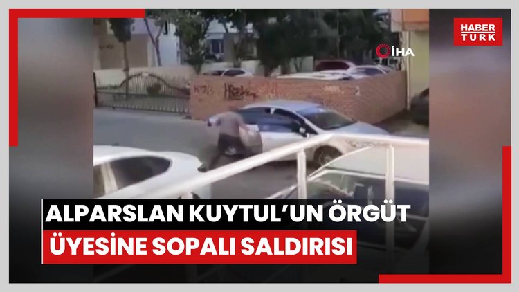 Alparslan Kuytul, kendinden habersiz hareket eden örgüt üyesinin sırtında sopa kırmış
