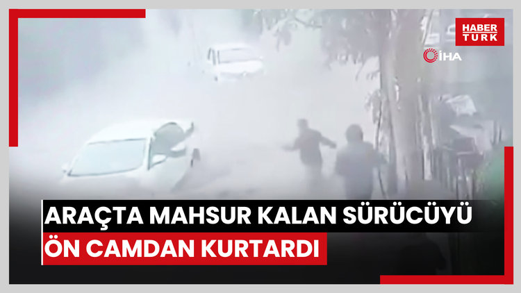 Araçta mahsur kalan sürücüyü ön camdan kurtardı
