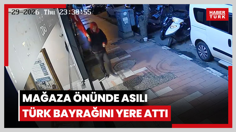 Mağaza önünde asılı Türk bayrağını yere attı
